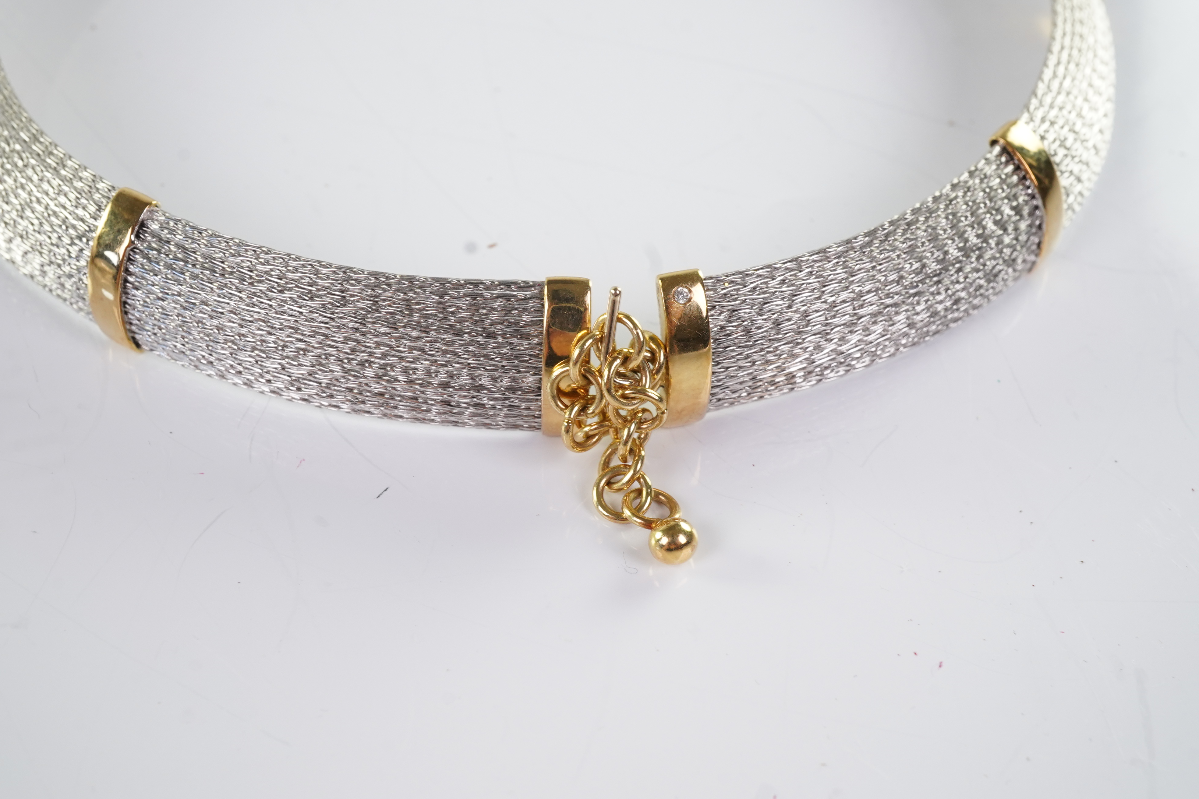 An 18ct gold collar and bangle